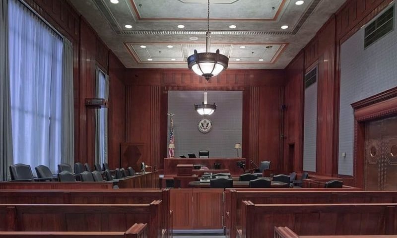 Inside of a courtroom showing the seating area for a jury panel